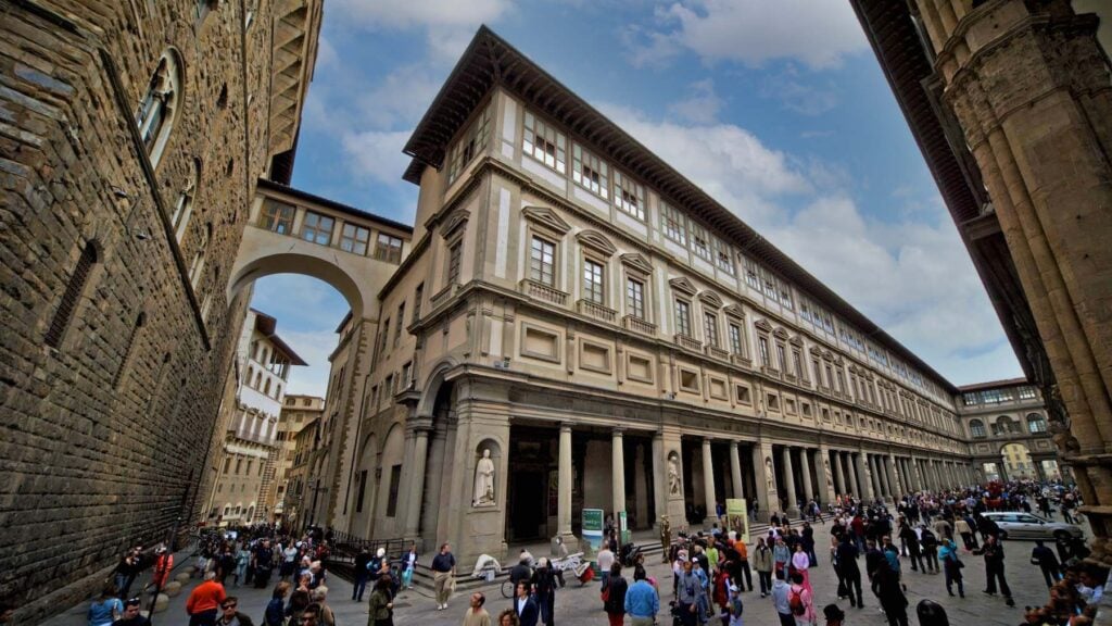 Crowds flow in and out of the Uffizi Gallery