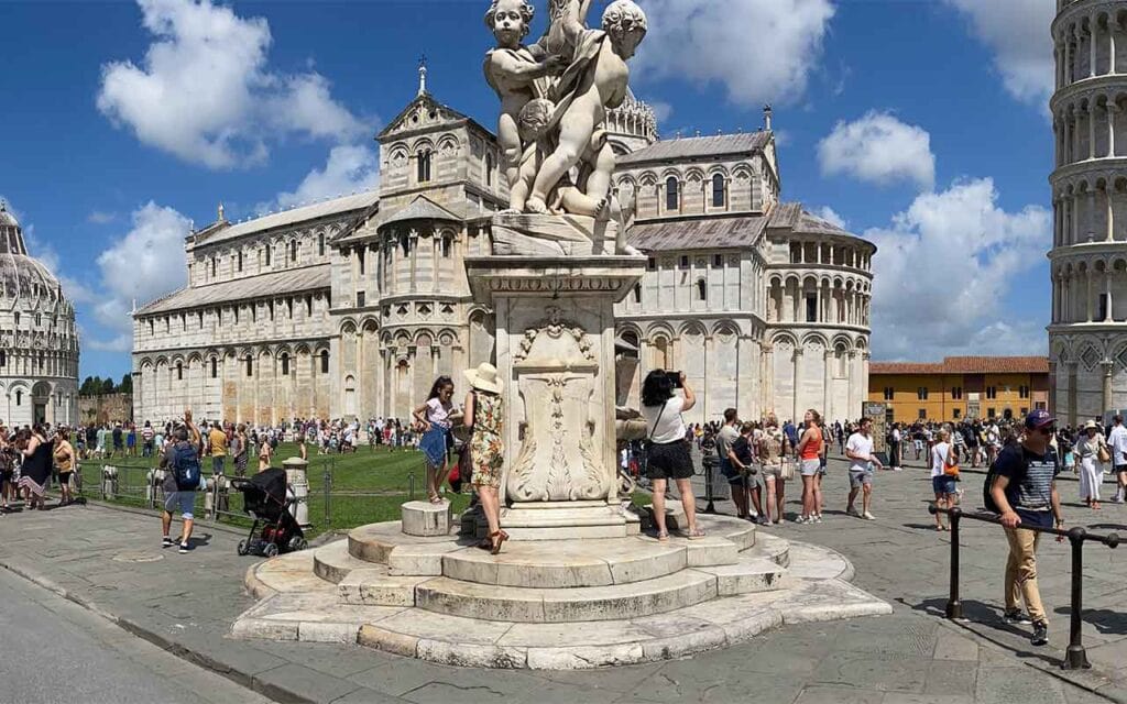 View of the Pisa Cathedral, Baptistery, and Leaning Tower in Piazza dei Miracoli under a clear blue sky Day trips from Florence

