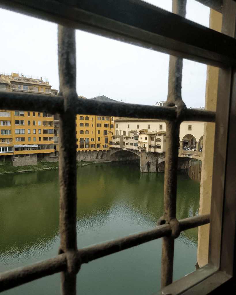 a stunning view of ponte vecchio from vasari corridor
