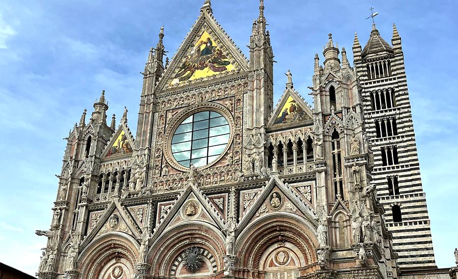 Front view of Siena Cathedral with its intricate Gothic architecture, a must-see during a Siena day trip from Florence.