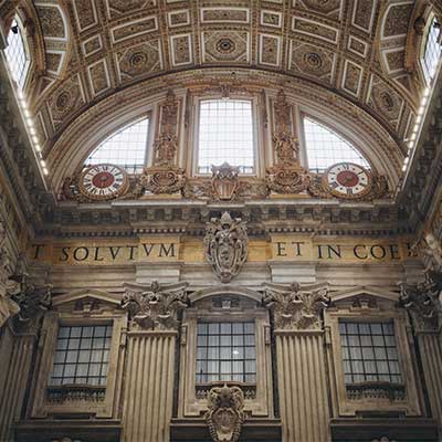 St. Peter’s Basilica Interior – Latin Inscription and Clocks