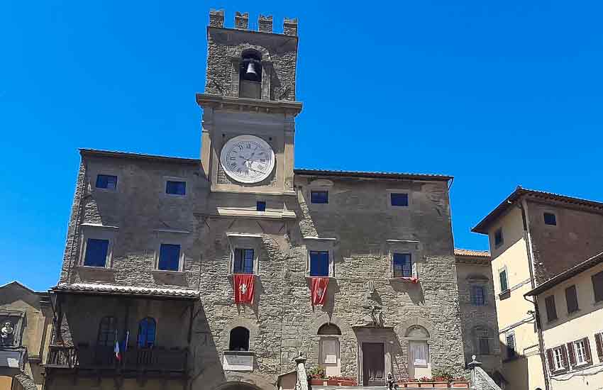 Palazzo Comunale with clock tower in the main square of Cortona, Tuscany, Italy