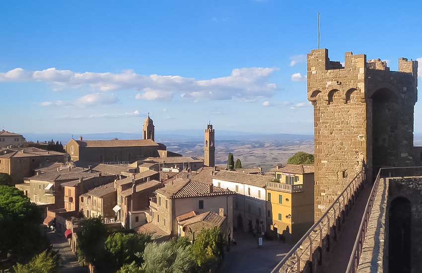 View of Montalcino and its fortress tower overlooking the Tuscan countryside, Italy