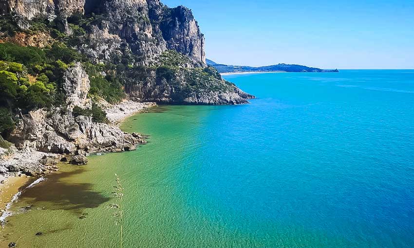 Dramatic cliffs and turquoise sea along the Sperlonga coastline in Italy