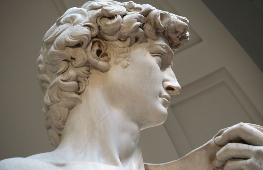 Close-up of Michelangelo’s David statue at the Accademia Gallery in Florence.