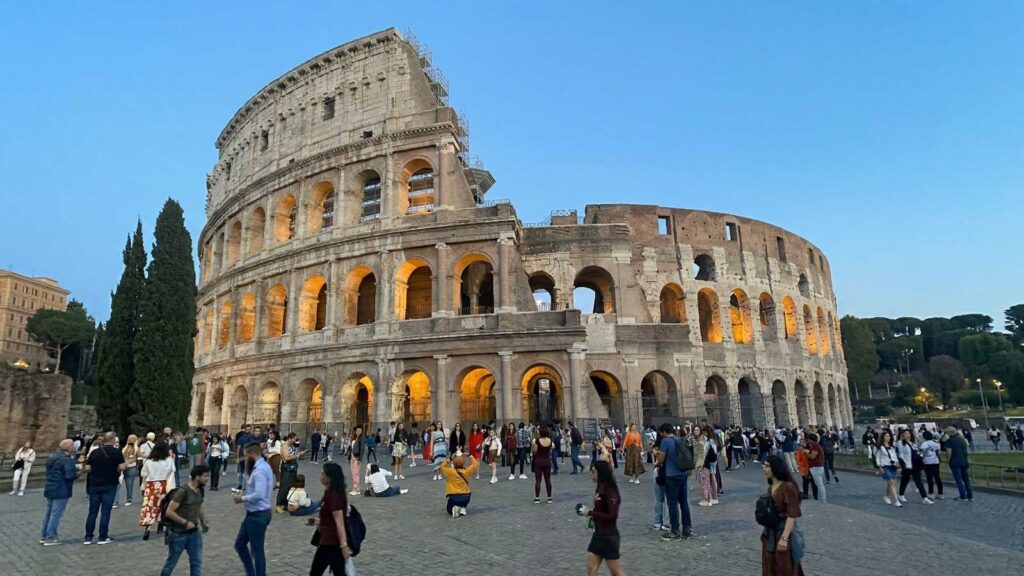 Rome travel guide — the Colosseum illuminated at golden hour