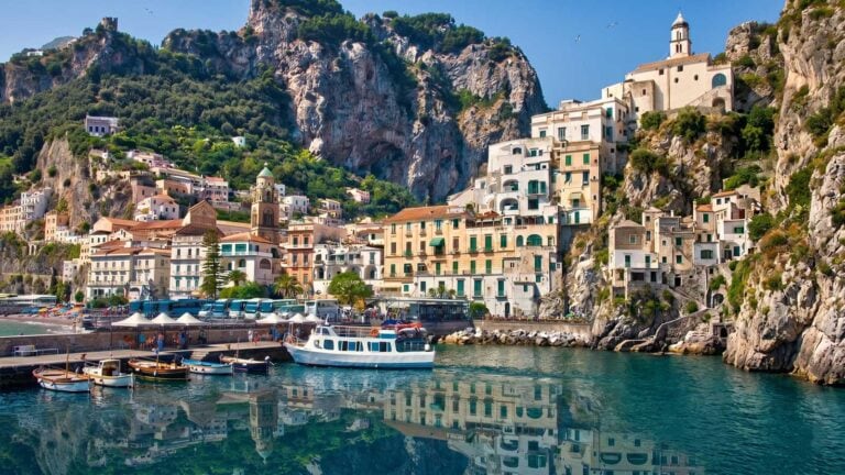Amalfi town harbour with ferry and SITA buses parked at the dock, the carless way to reach the Amalfi Coast